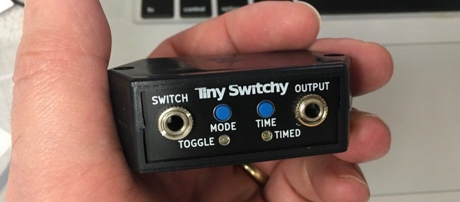 hand holding tiny switchy device